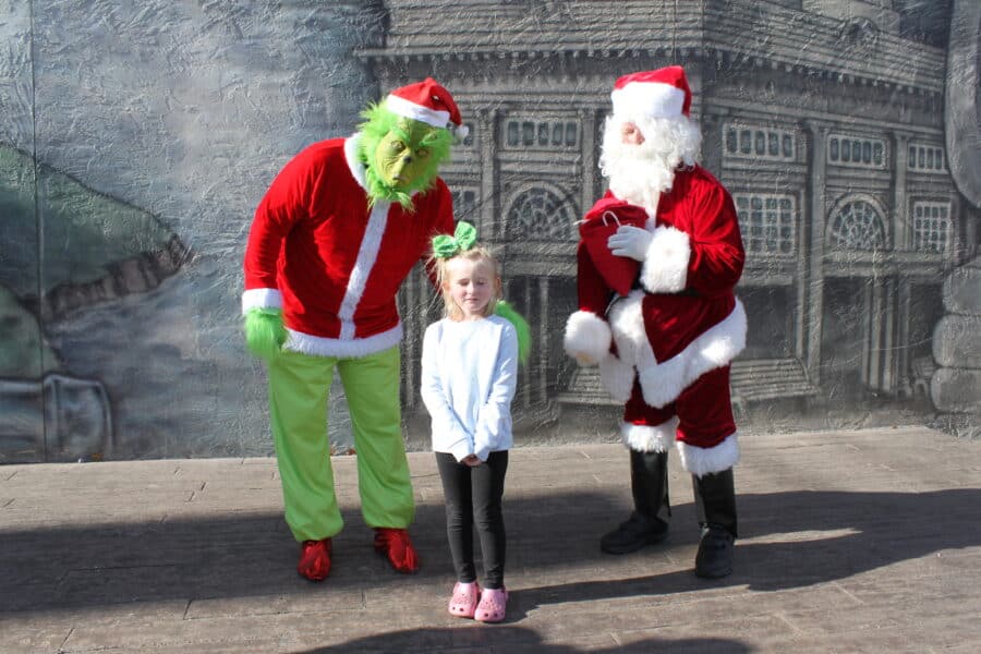 Girl with Grinch and Santa