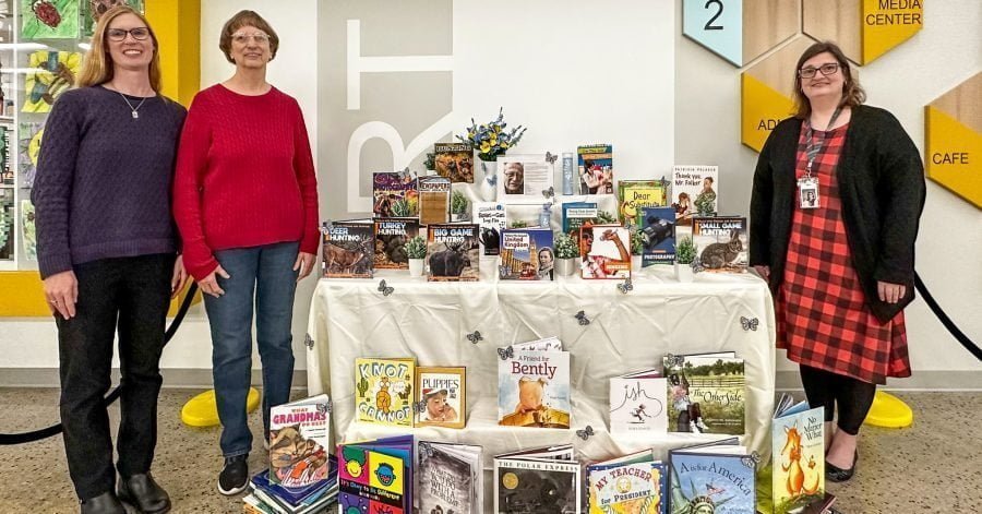 Phil's daughter Susan, his wife Sharon, and Cornerstone Librarian Cheryl Bailey proudly pose with the Phil Senger Book Collection (photo S Jason Cole).