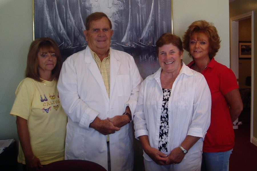 Dr. Robert Shemwell and his wife Patty, along with two assistants at the podiatry clinic